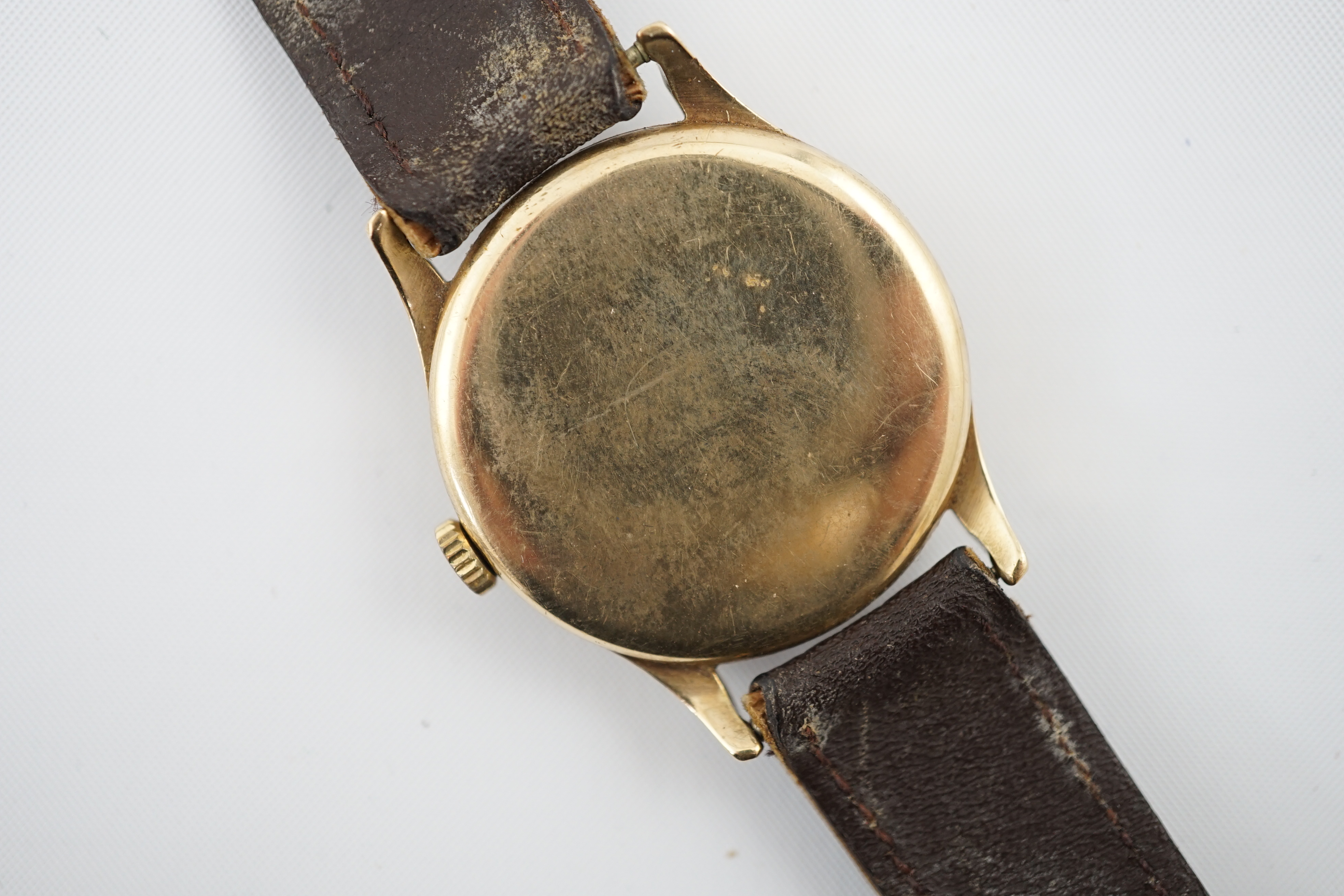 A gentleman's early 1940's 9ct gold Omega manual wind wrist watch